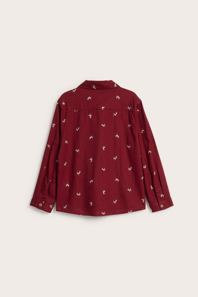Kids red shirt with reindeer pattern