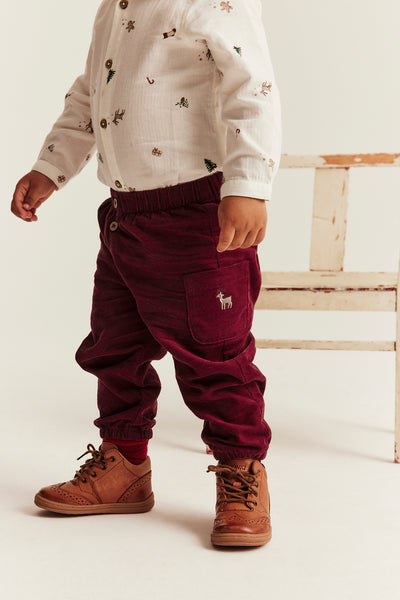 Baby red corduroy trousers with embroidery