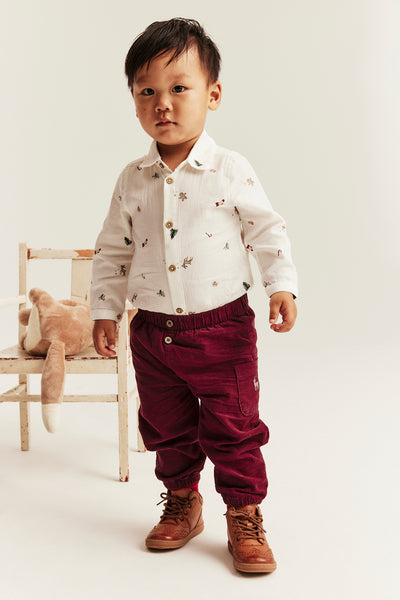Baby red corduroy trousers with embroidery
