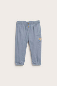 Baby blue corduroy trousers with embroidery