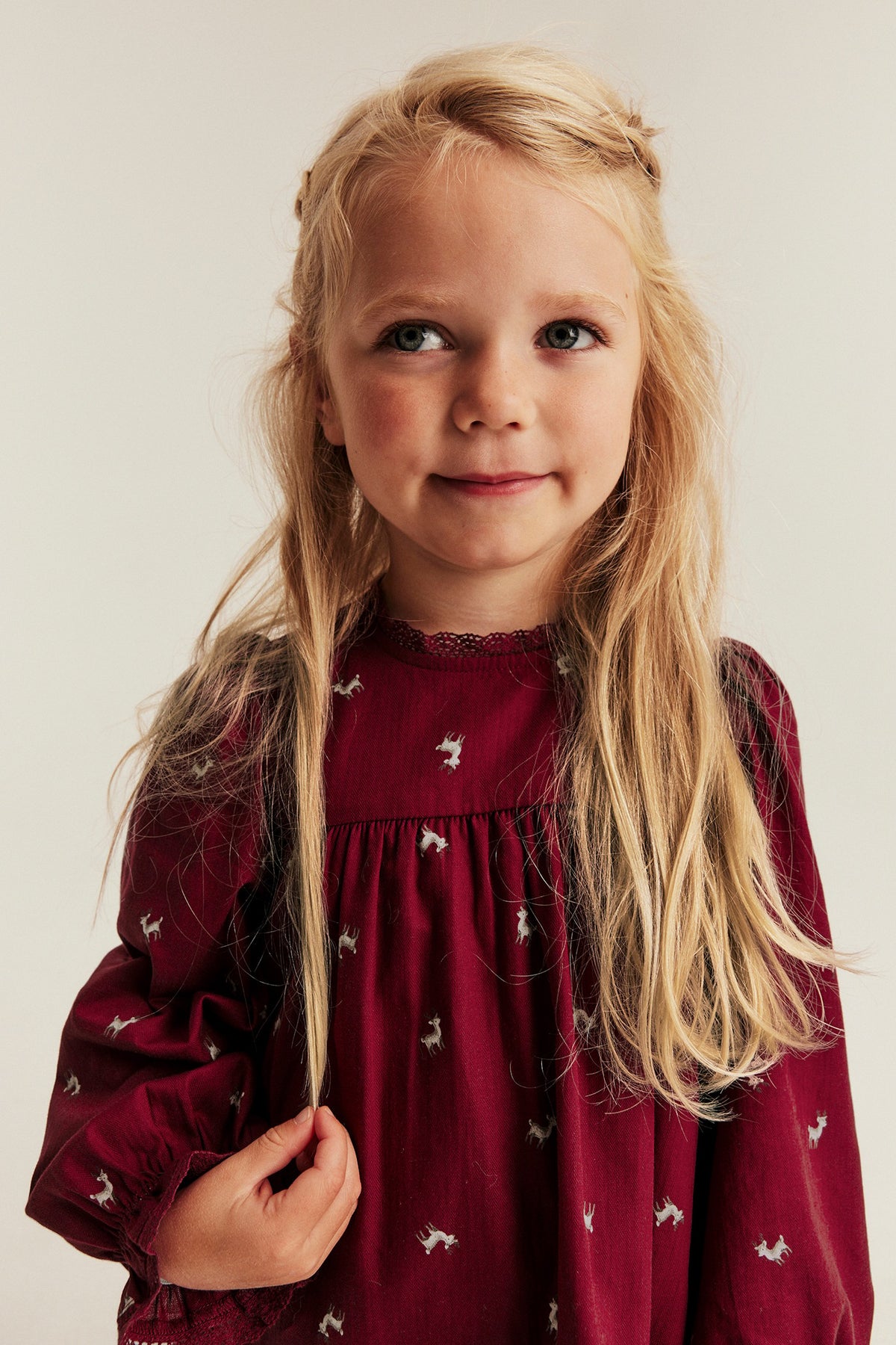 Kids red long-sleeved dress with reindeers