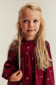 Kids red long-sleeved dress with reindeers