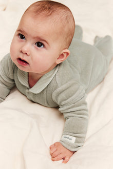 Baby green pyjamas in velour with a collar
