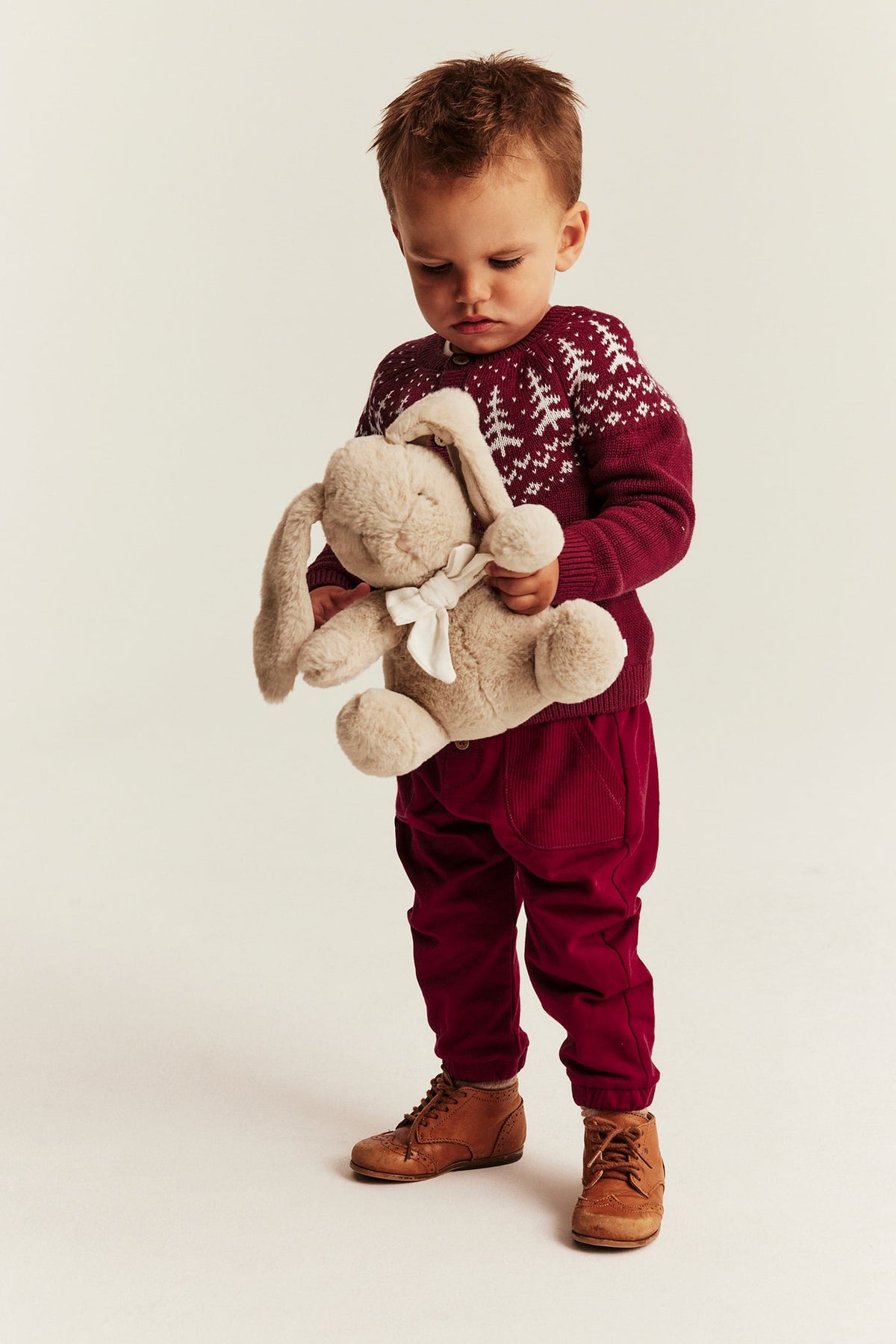 Baby red knitted cardigan with Christmas trees