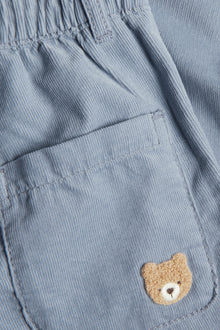 Kids blue trousers with teddy bear