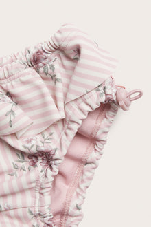 Baby pink floral swim trunks with frill