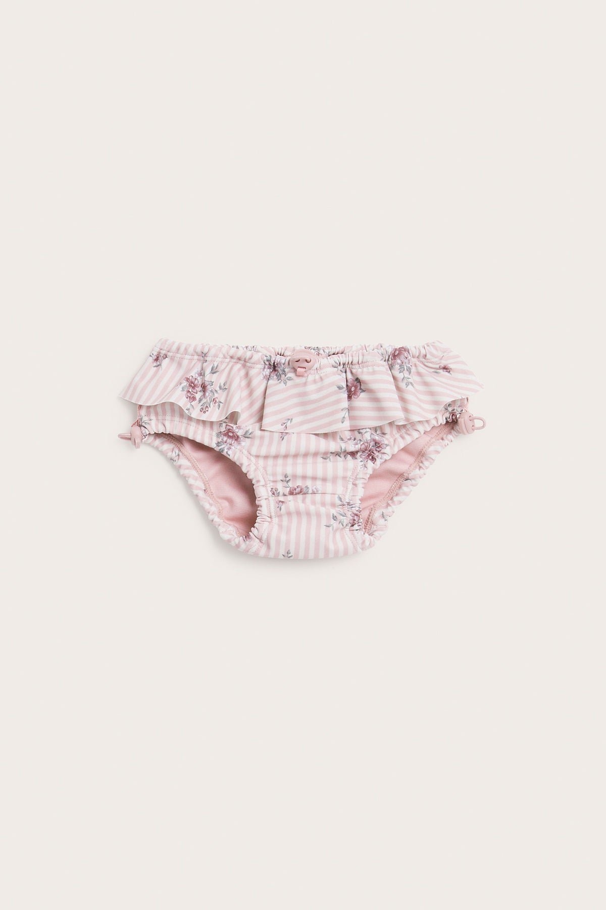 Baby pink floral swim trunks with frill