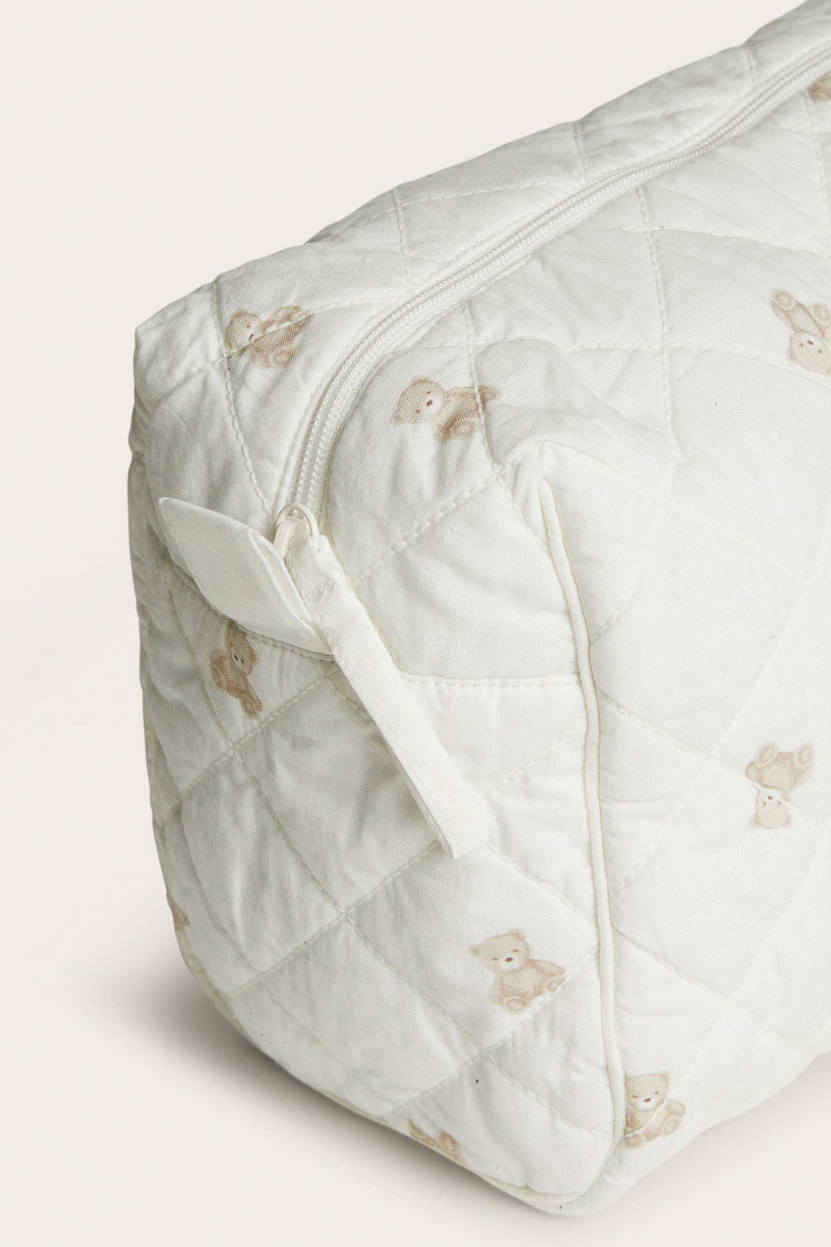 White quilted toiletry bag with teddy bear pattern