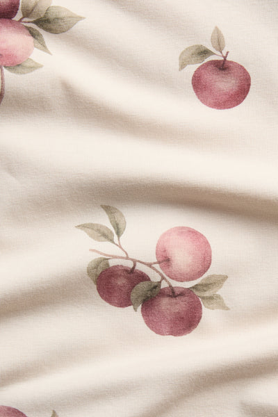 Baby beige bodysuit with apple pattern