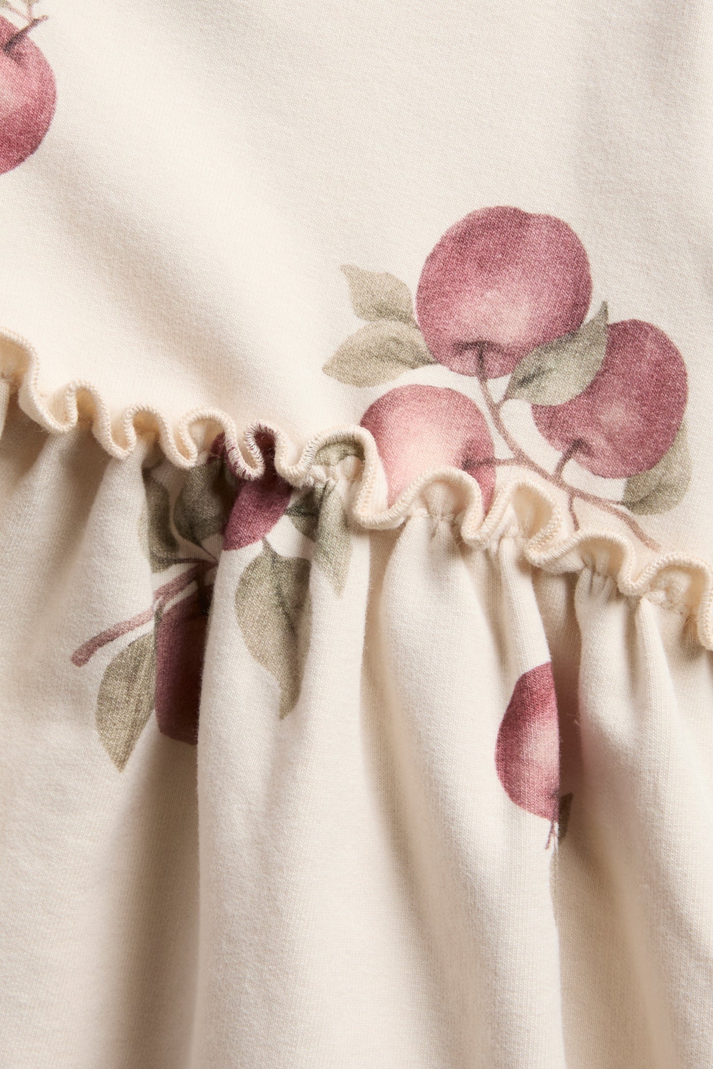 Baby beige dress with apple pattern