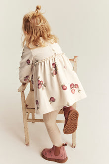Baby beige dress with apple pattern