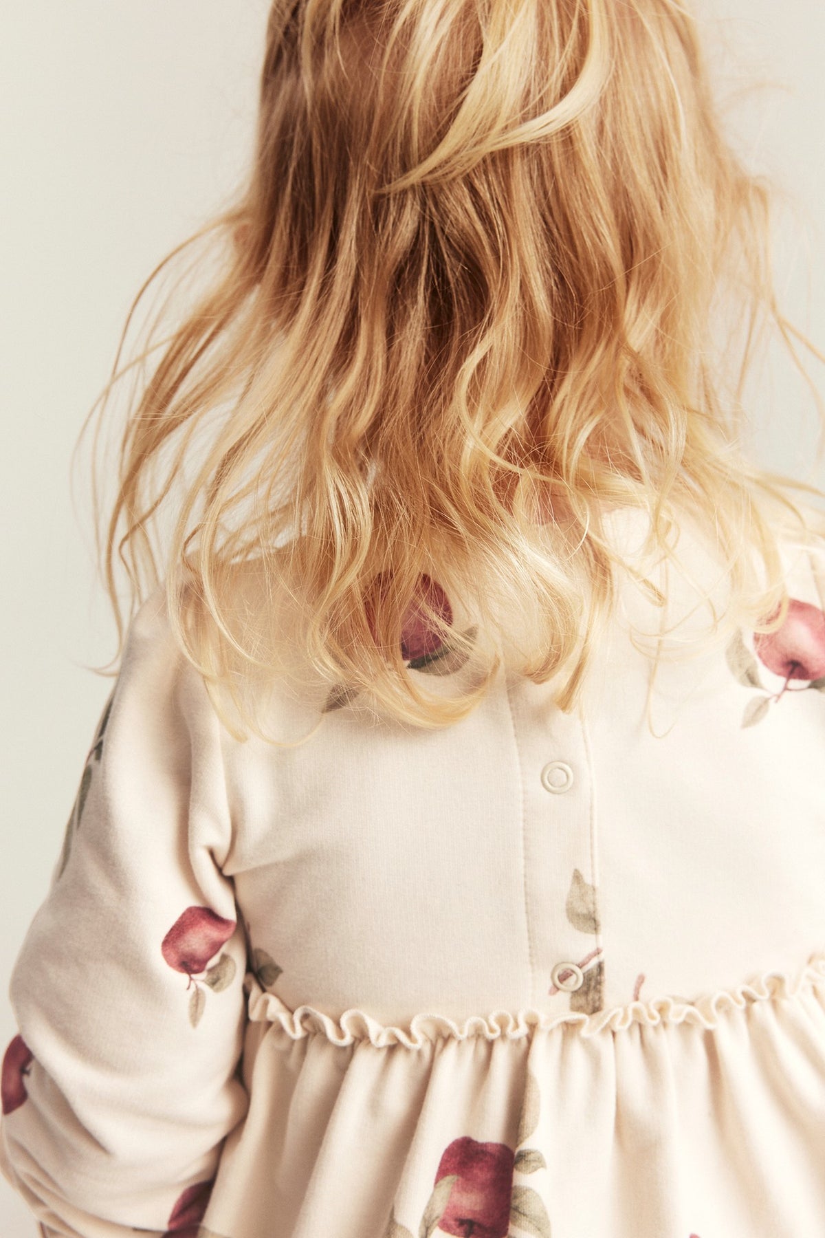Baby beige dress with apple pattern
