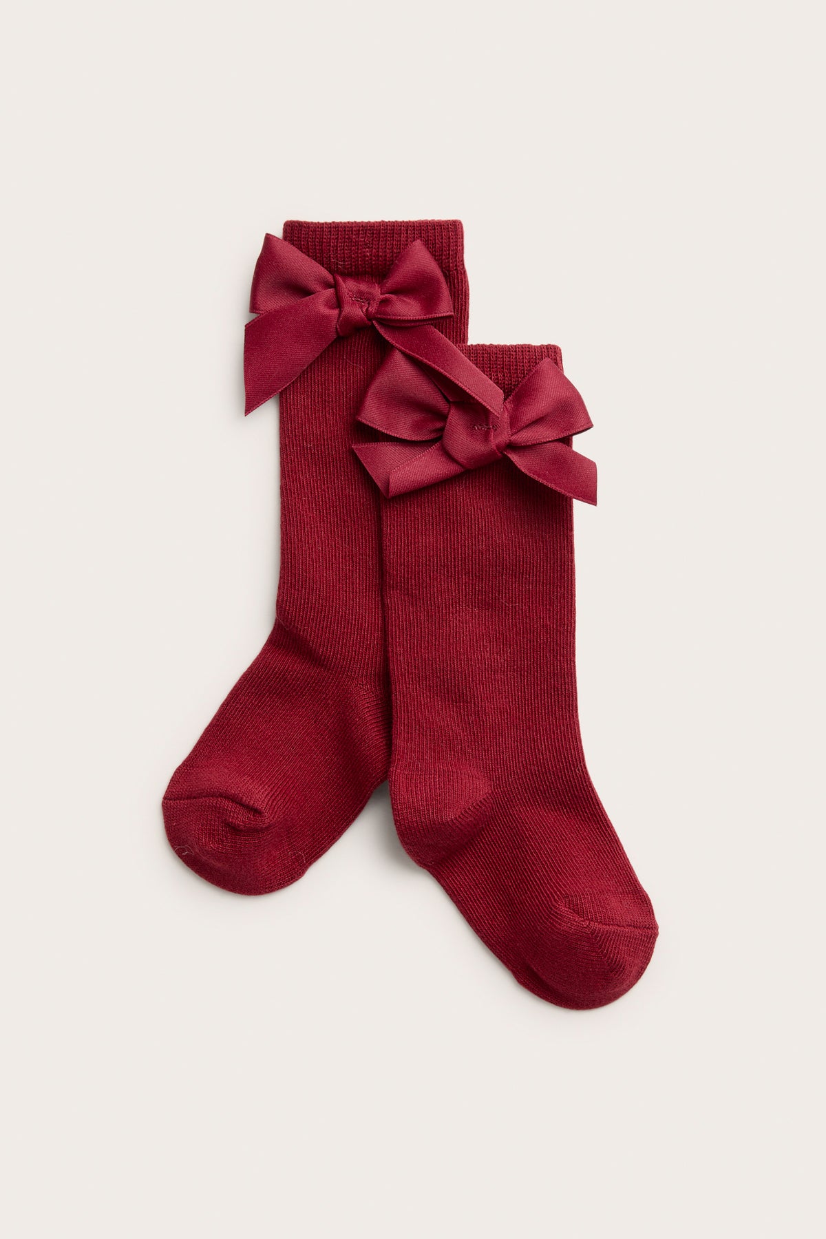 Baby red knee-highs with satin bow