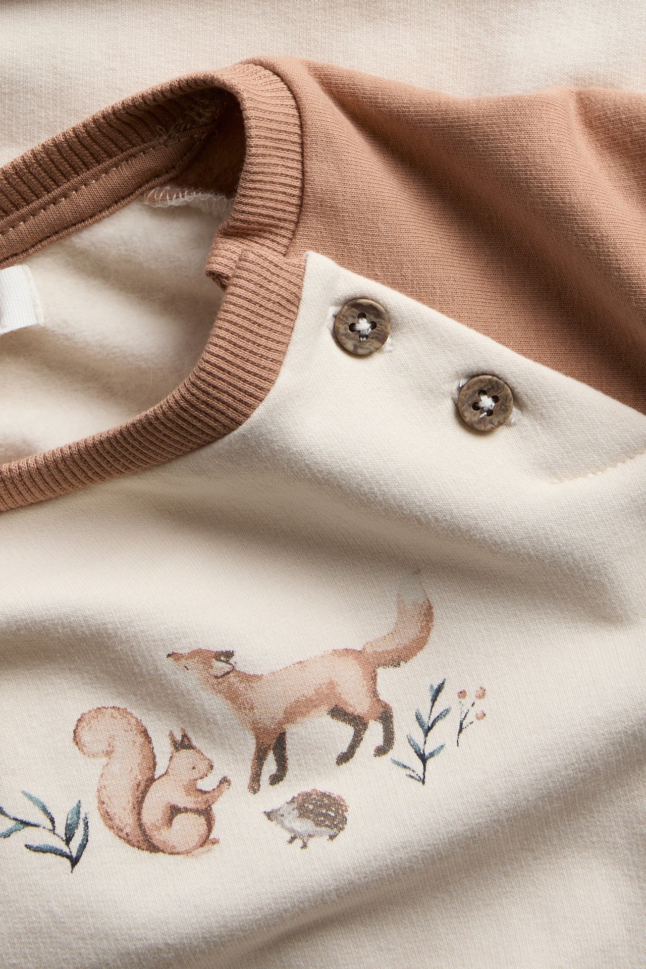 Baby beige sweatshirt with animal print