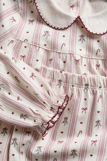 Kids white & red Christmas pyjamas with bows