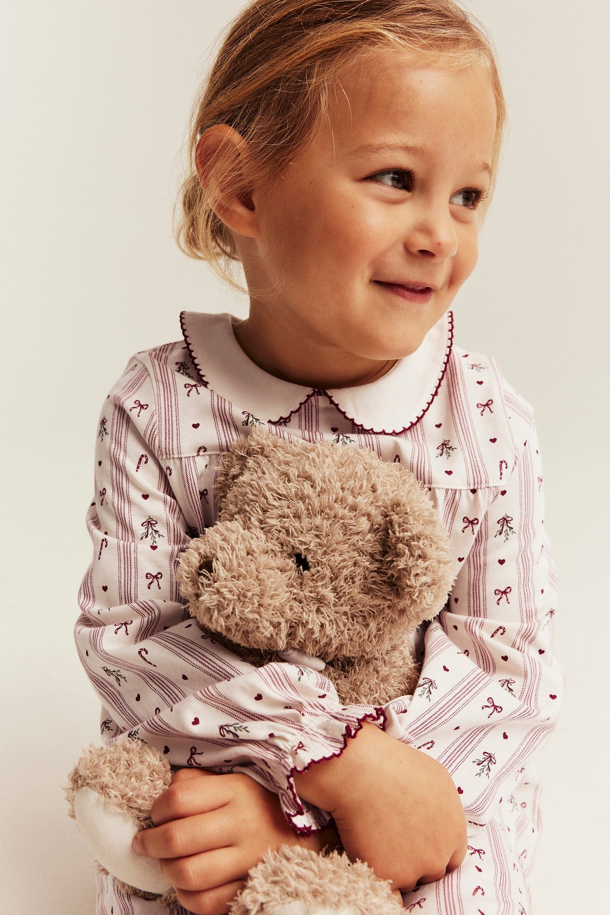 Kids white & red Christmas pyjamas with bows