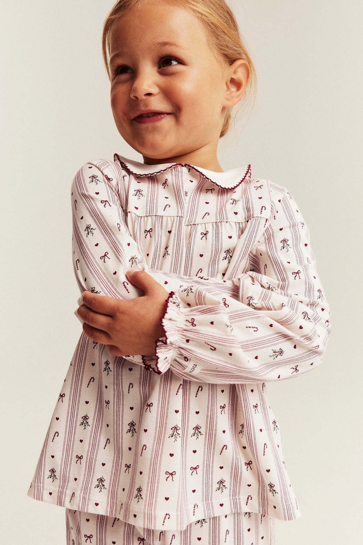 Kids white & red Christmas pyjamas with bows