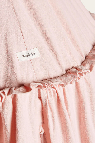 Pink reading tent with pom-poms