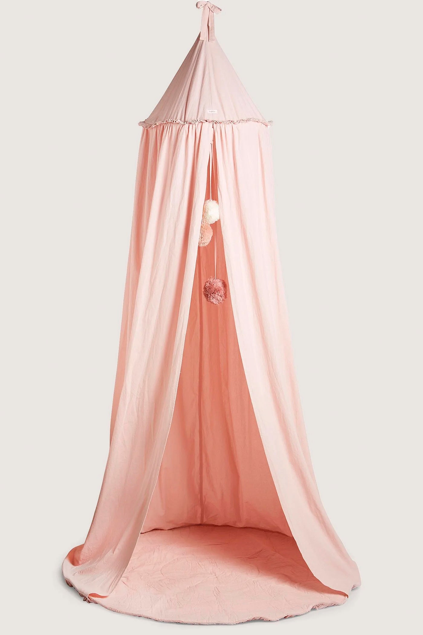 Pink reading tent with pom-poms