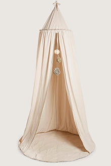 Beige reading tent with pom poms
