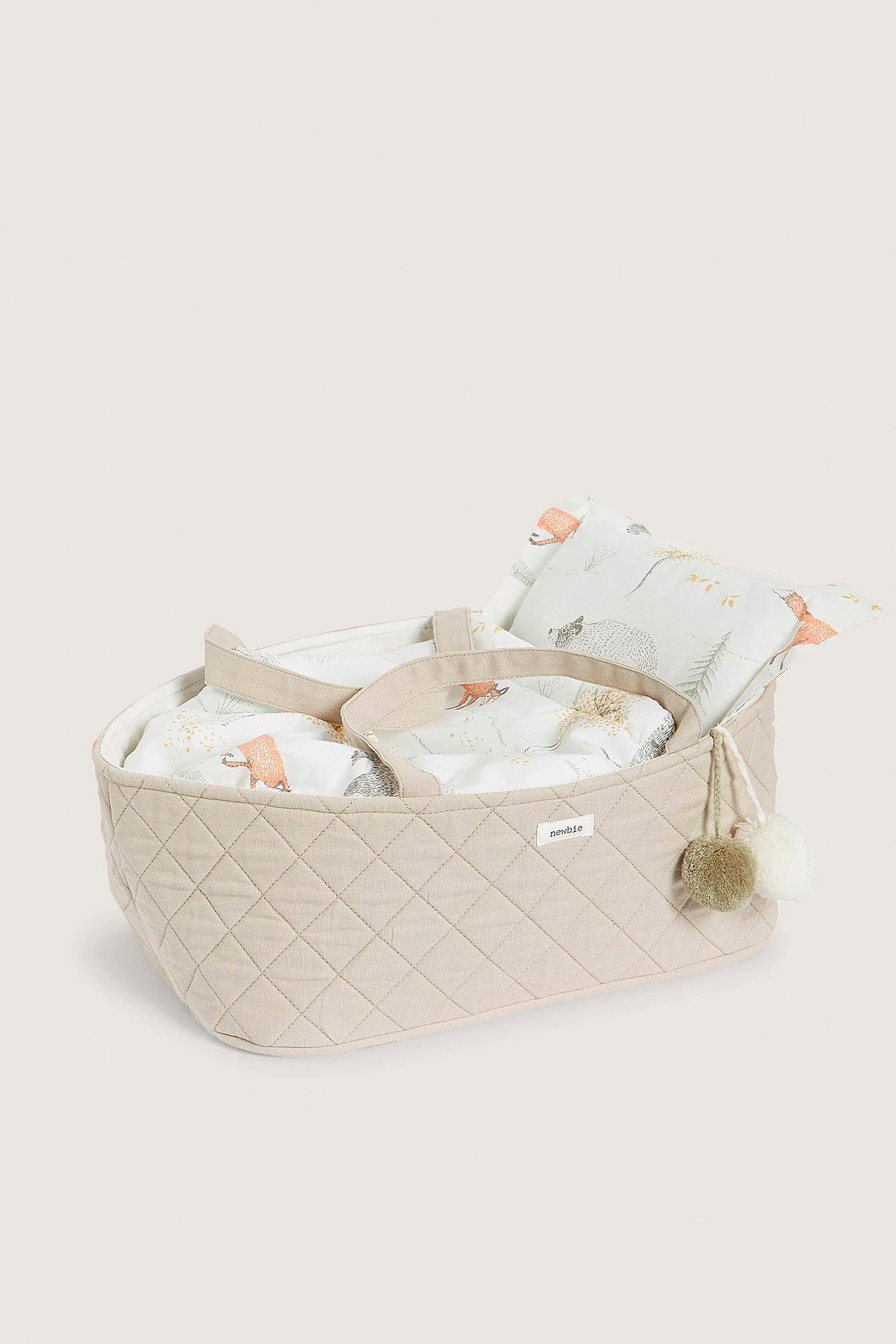 Beige quilted doll basket
