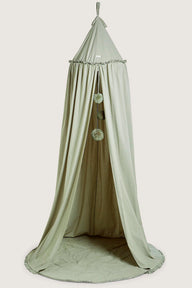 Green reading tent with pom-poms